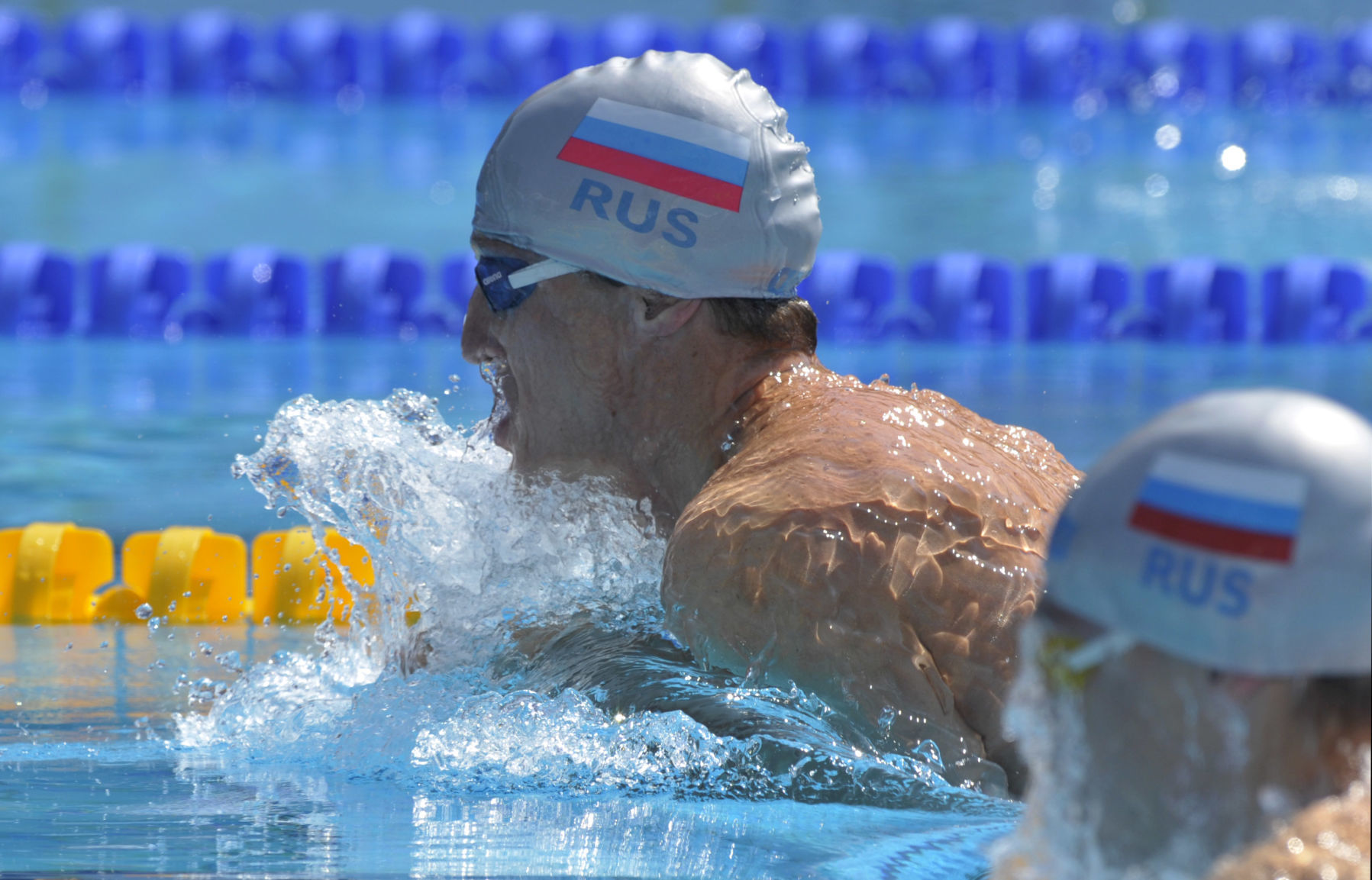 2001: Russian swimmer Roman Sludnov swims 100 breast in under 1 minute